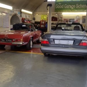 Two cars inside the workshop at AH Advanced Autos Ltd